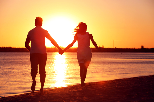 Young Couple In Love On Summer Sunset Beach