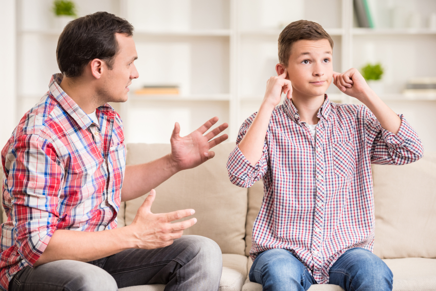 Son Closing Ears While Father Scolding  Him.