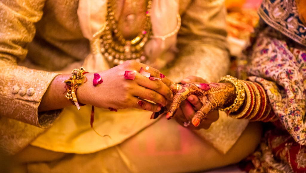 Indian Wedding Ring  Ceremony.hands Of The Bride Held By A Groom During A Traditional Ritual In An Indian Hindu Wedding